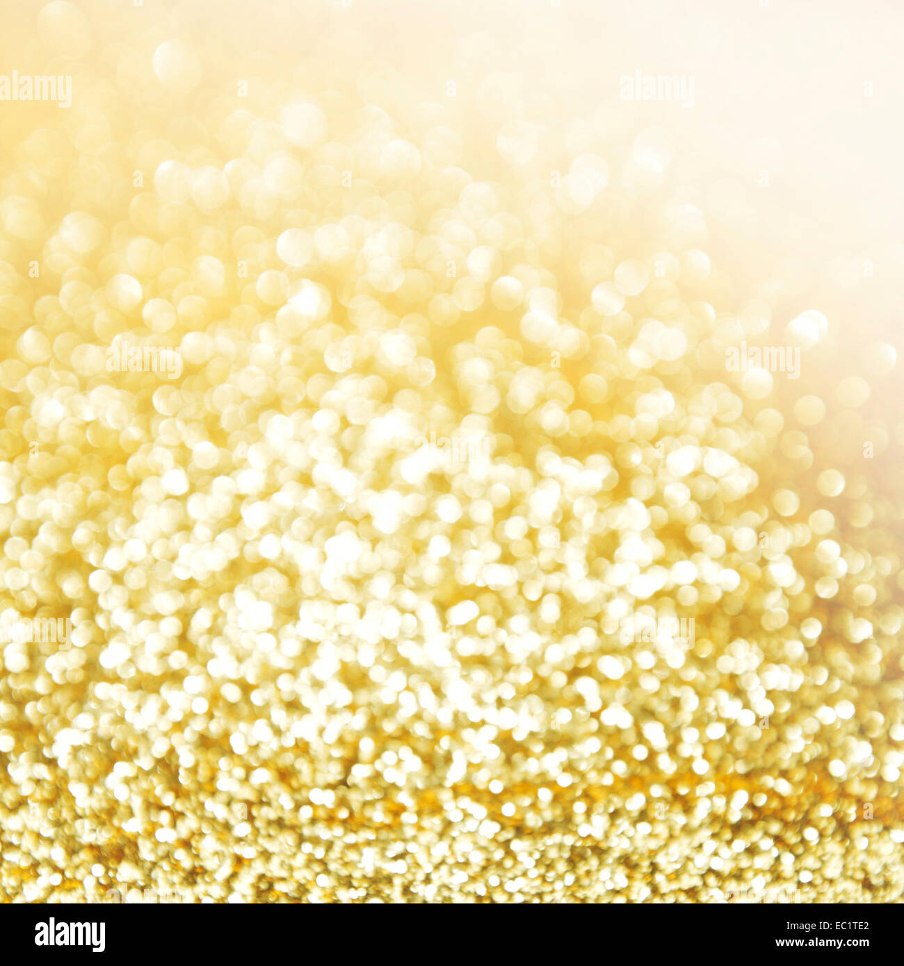 Golden festive glitter background with defocused lights Stock Photo - Alamy