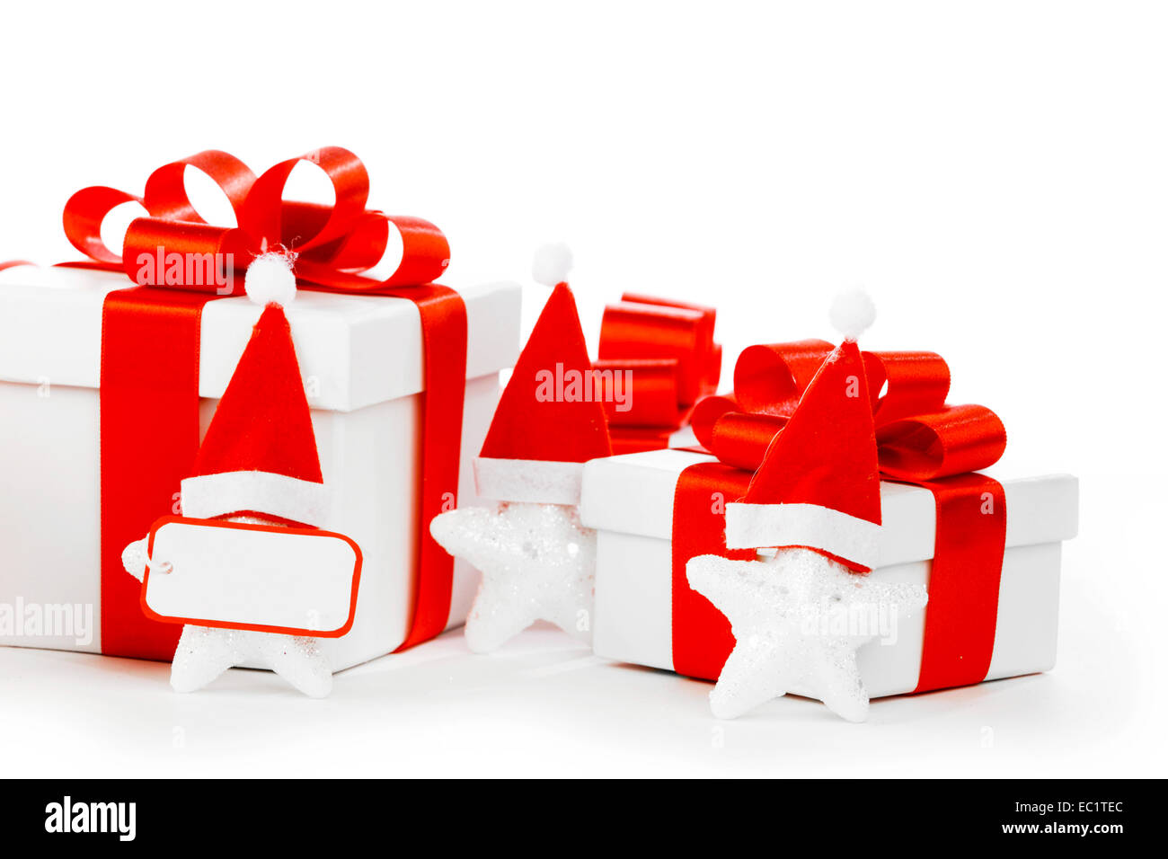 White gift box with red ribbon bow isolated on white background close ...