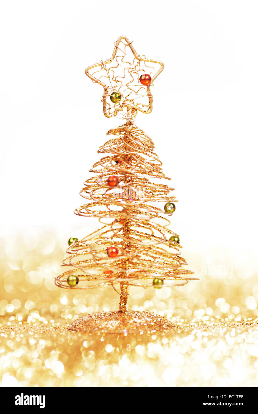 Toy golden decorative Christmas tree on glitter background Stock Photo ...