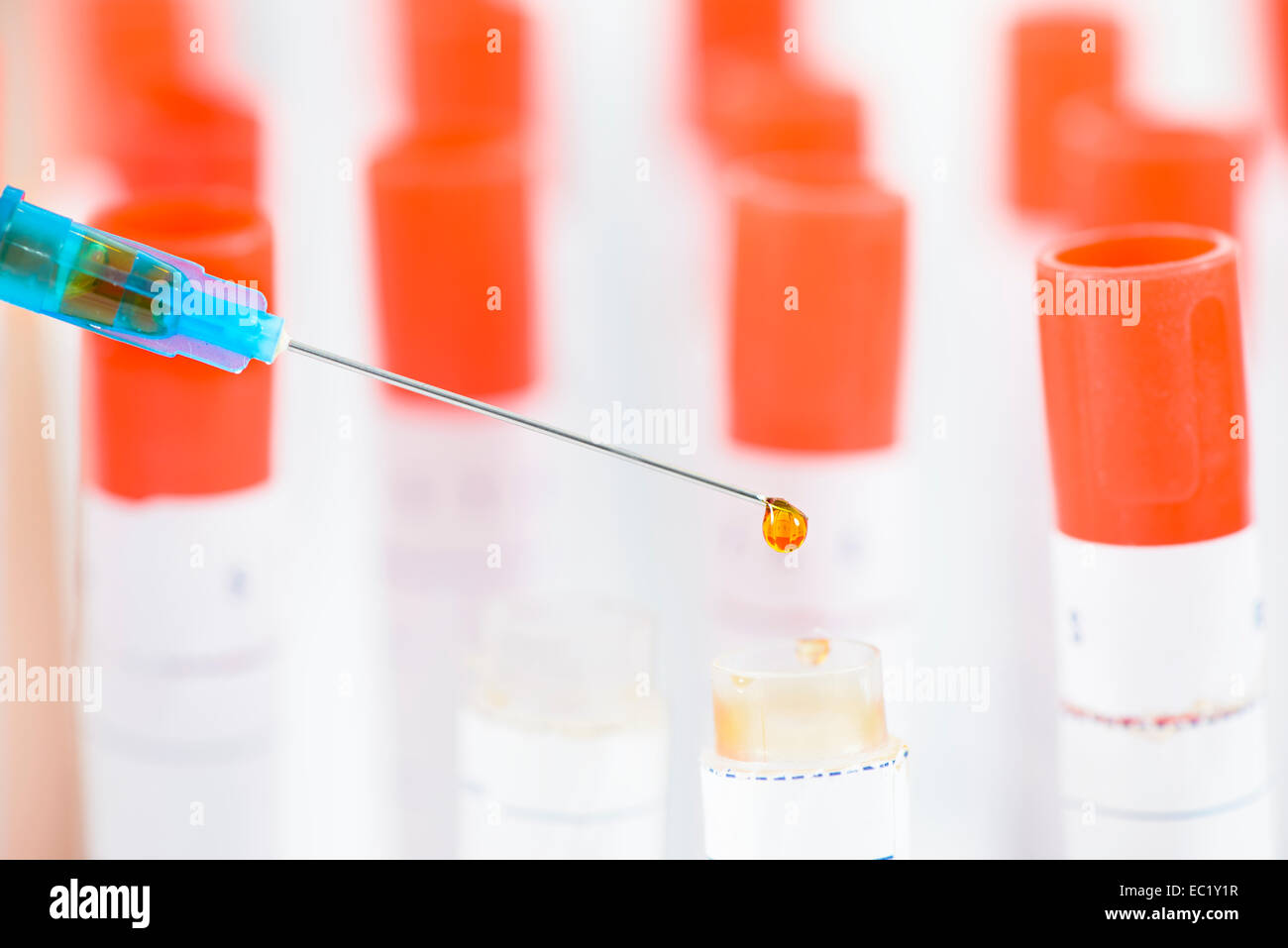 Dripping Syringe biological material in a lab Stock Photo Alamy