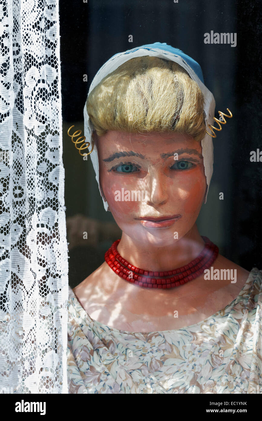 Display dummy in Dutch traditional costume in a window, Arnemuiden, Wacheren Peninsula, Zeeland province, The Netherlands Stock Photo