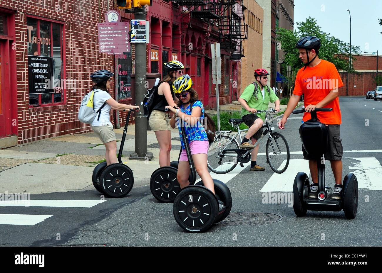 PHILADELPHIA, PA:  A group of tourists practise their skills on  two wheeled Segues Stock Photo