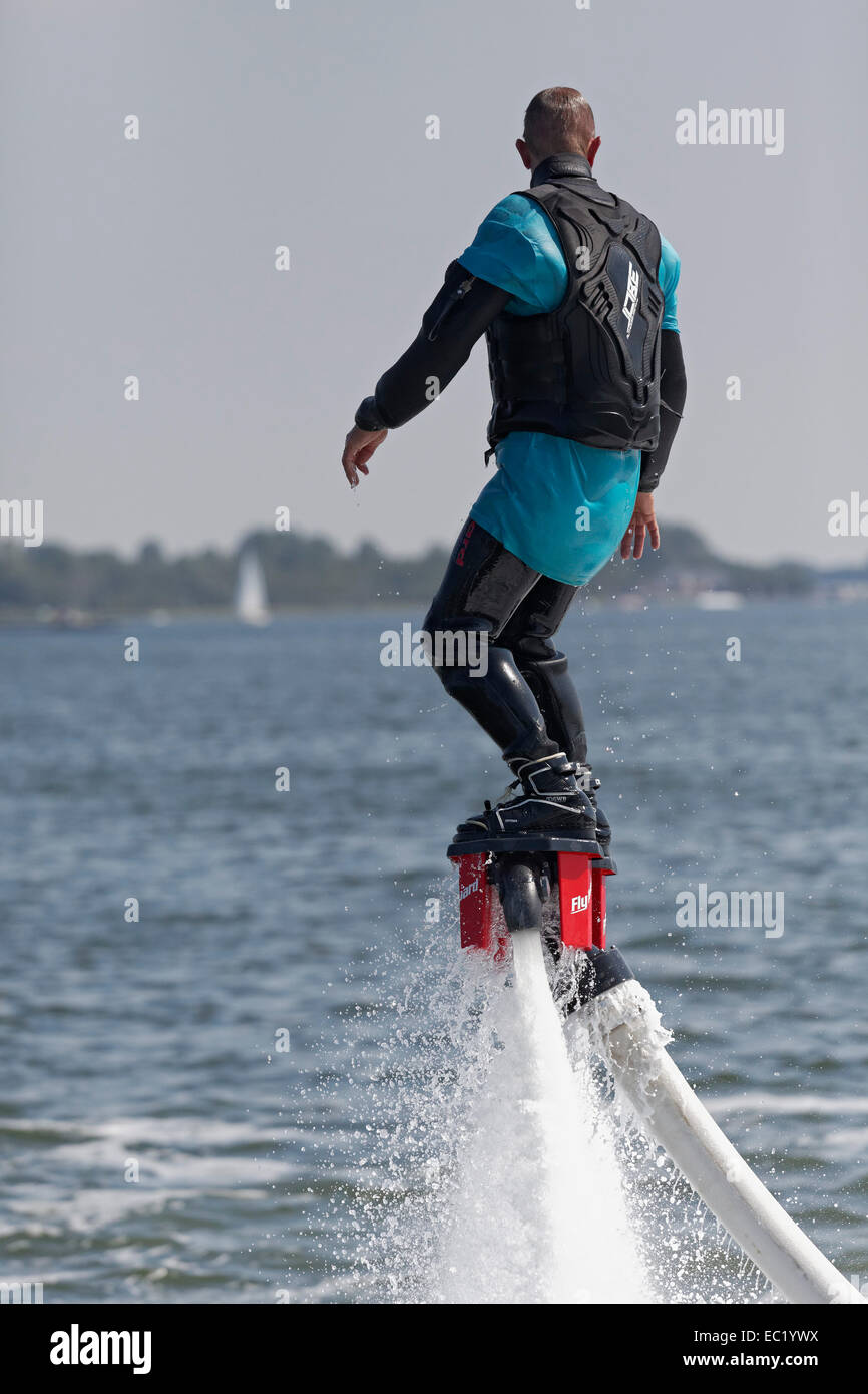 Flyboarder on the water jet of a jet ski, Walcheren, Zeeland province, The Netherlands Stock Photo