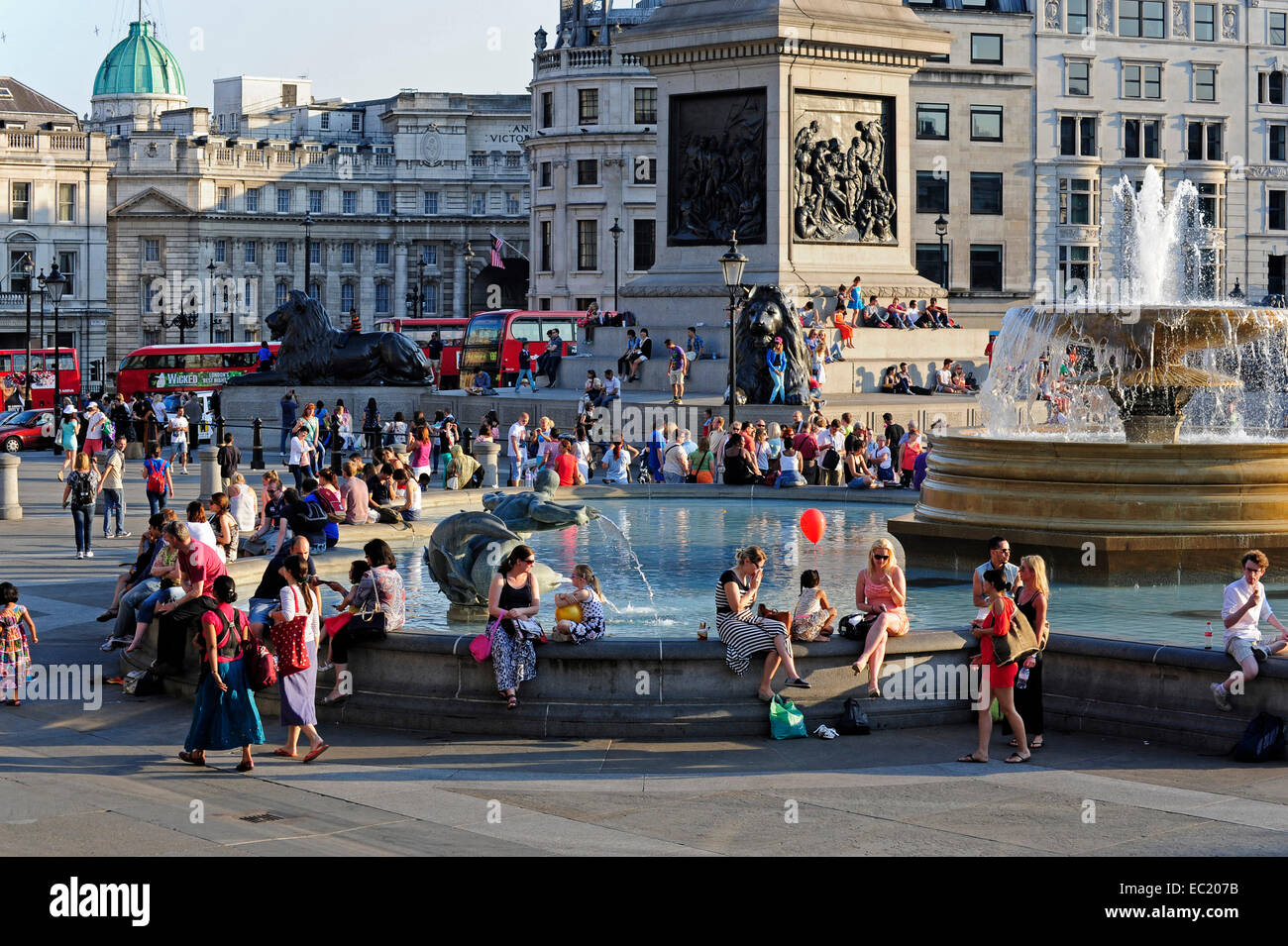 Fountain with people, Trafalgar Square, West End, London, England, United Kingdom Stock Photo