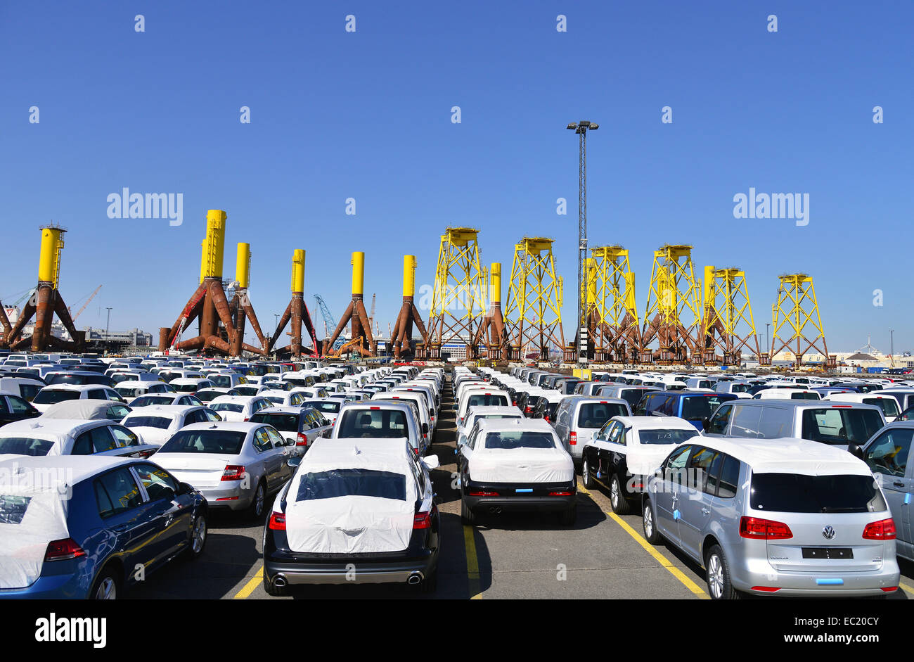 New cars, components for offshore wind turbines in the back, port, Bremerhaven, Bremen, Germany Stock Photo