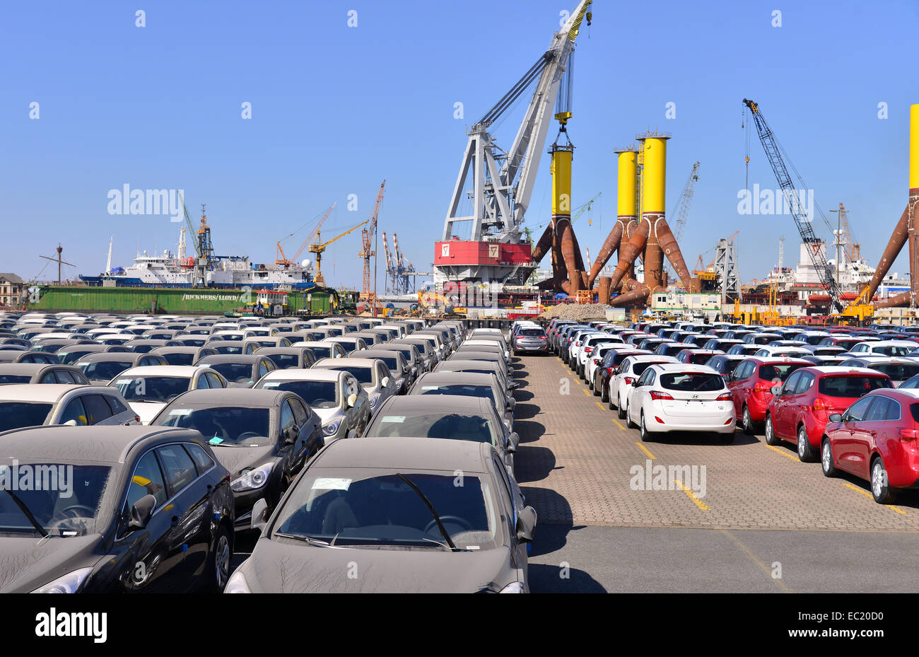 New cars, components for offshore wind turbines in the back, port, Bremerhaven, Bremen, Germany Stock Photo