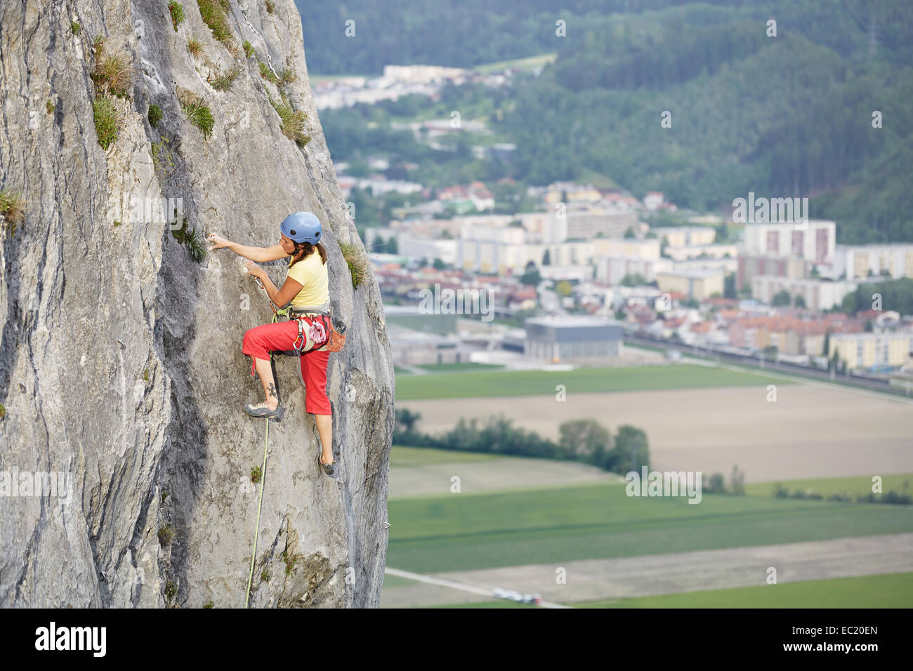 Freeclimber with helmet climbing on a rock face, Martinswand, gallery, Innsbruck, Tyrol, Austria Stock Photo