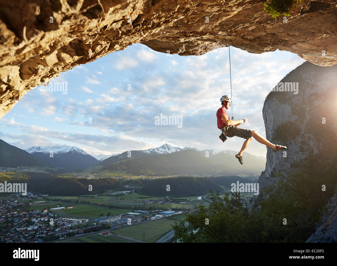 Freeclimber with helmet sits in the rope, Martinswand, gallery, Innsbruck, Tyrol, Austria Stock Photo