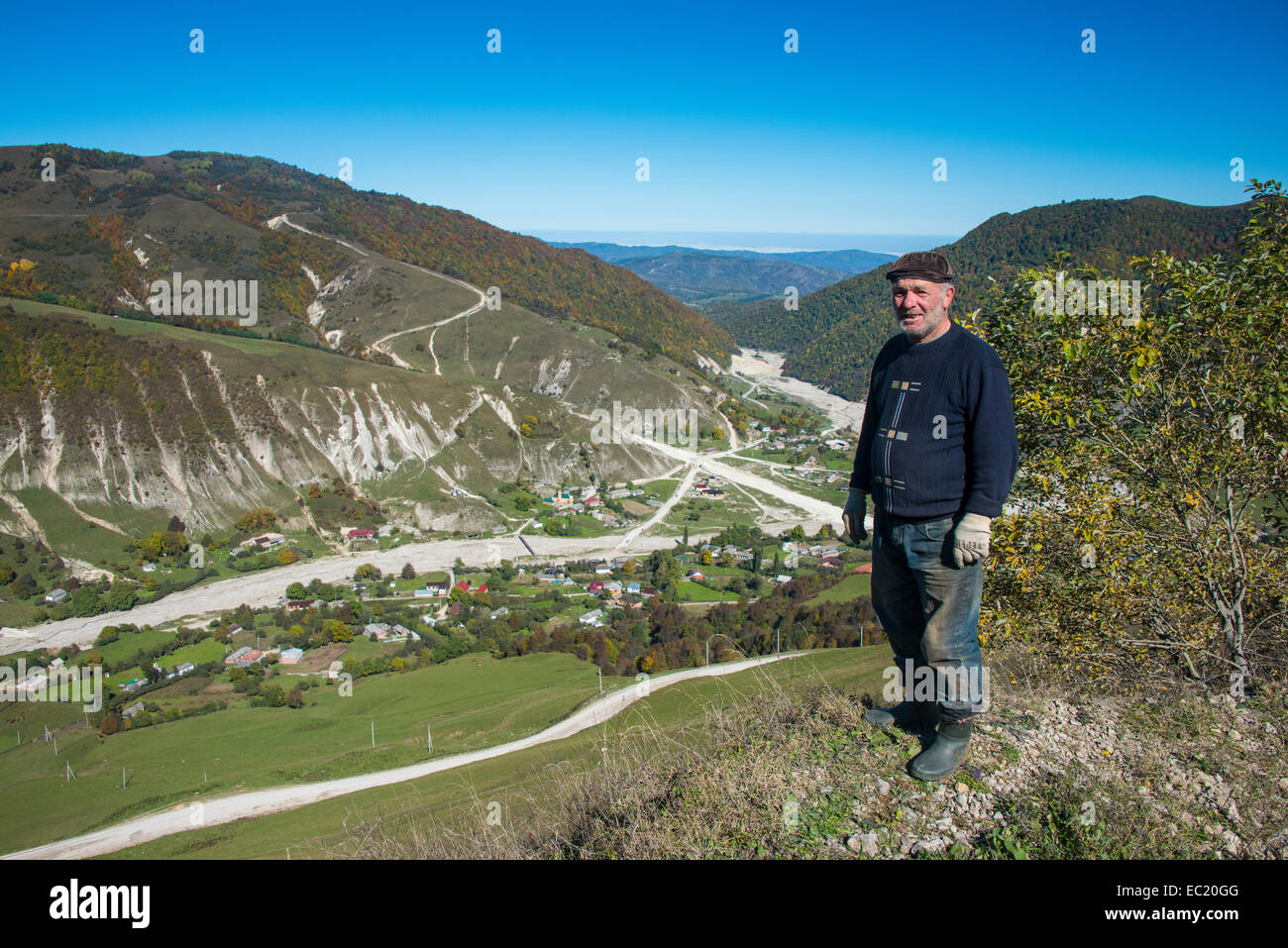 Old Chechen man at an overlook in the Chechen mountains, Chechnya, Caucasus, Russia Stock Photo