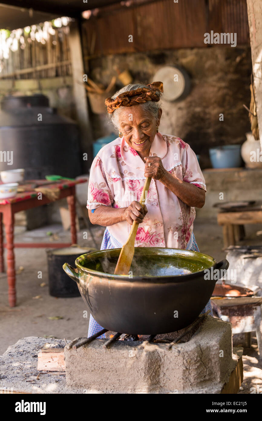 An elderly Oaxacan Zapotec cook prepares traditional food at El Sabor