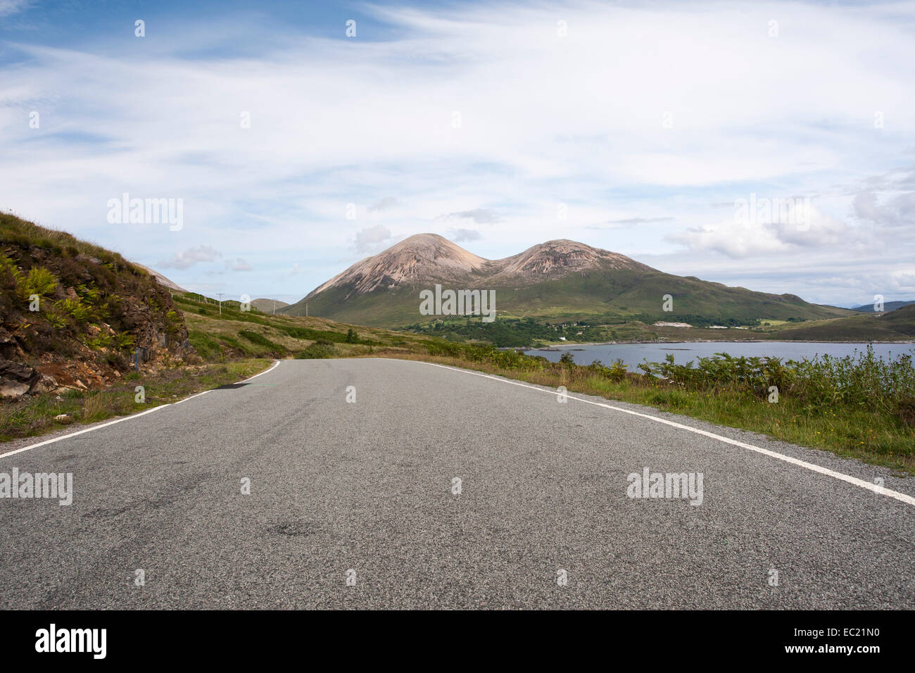 Country road B8083 with hills of Beinn Dearg Mhor and Beinn Dearg Bheag at the back, Strathaird, Isle of Skye, Scotland Stock Photo