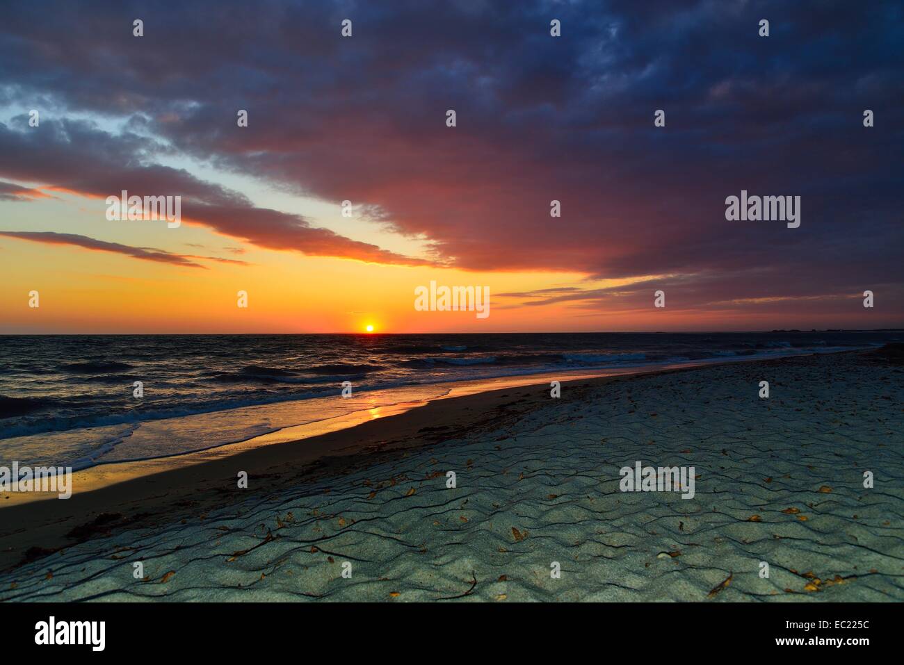 Sunset at sea with cloudy sky, Mari Ermi, Sinis Peninsula, Province of Oristano, Sardinia, Italy, Europe Stock Photo