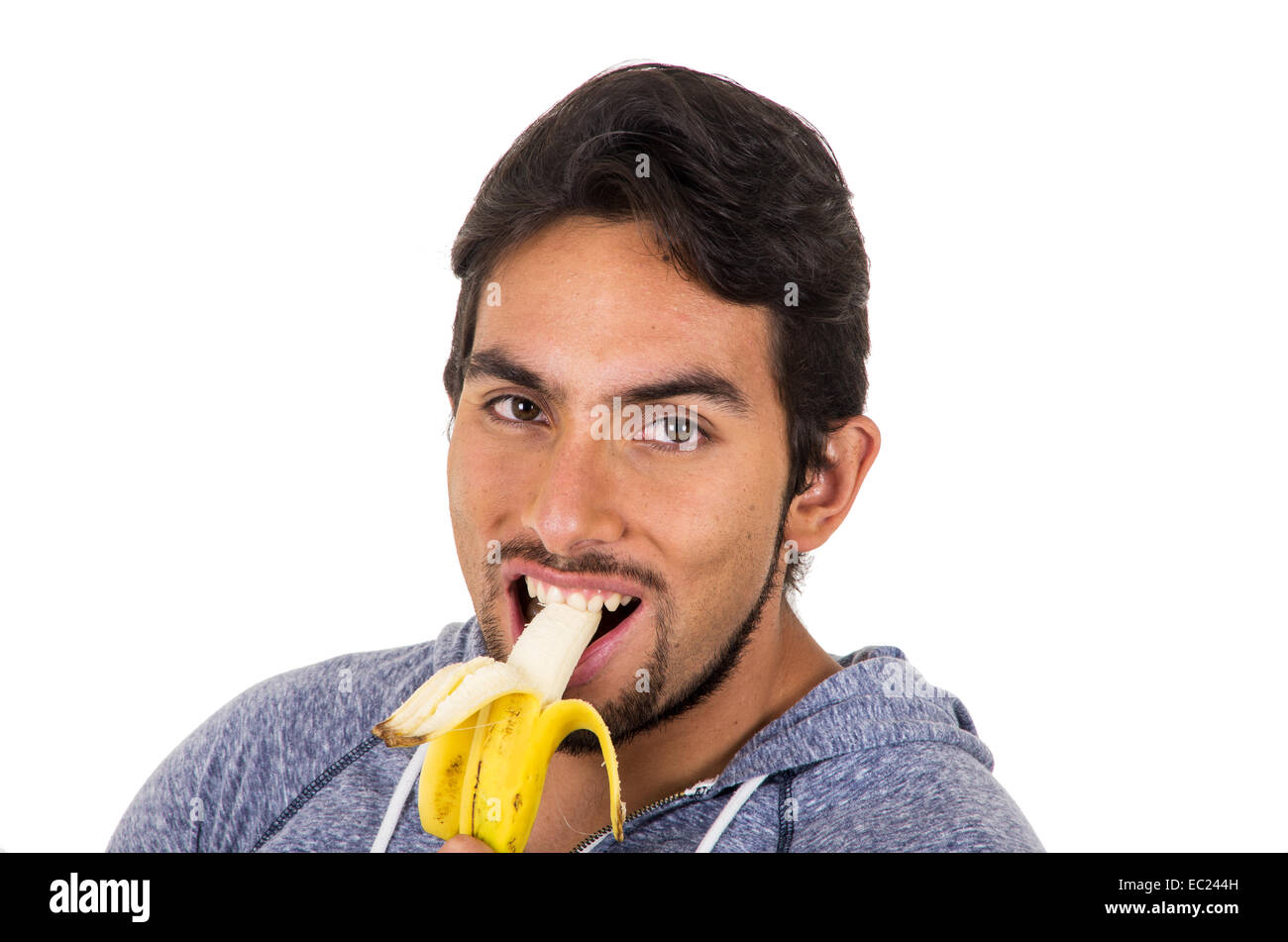handsome young man eating banana Stock Photo Alamy