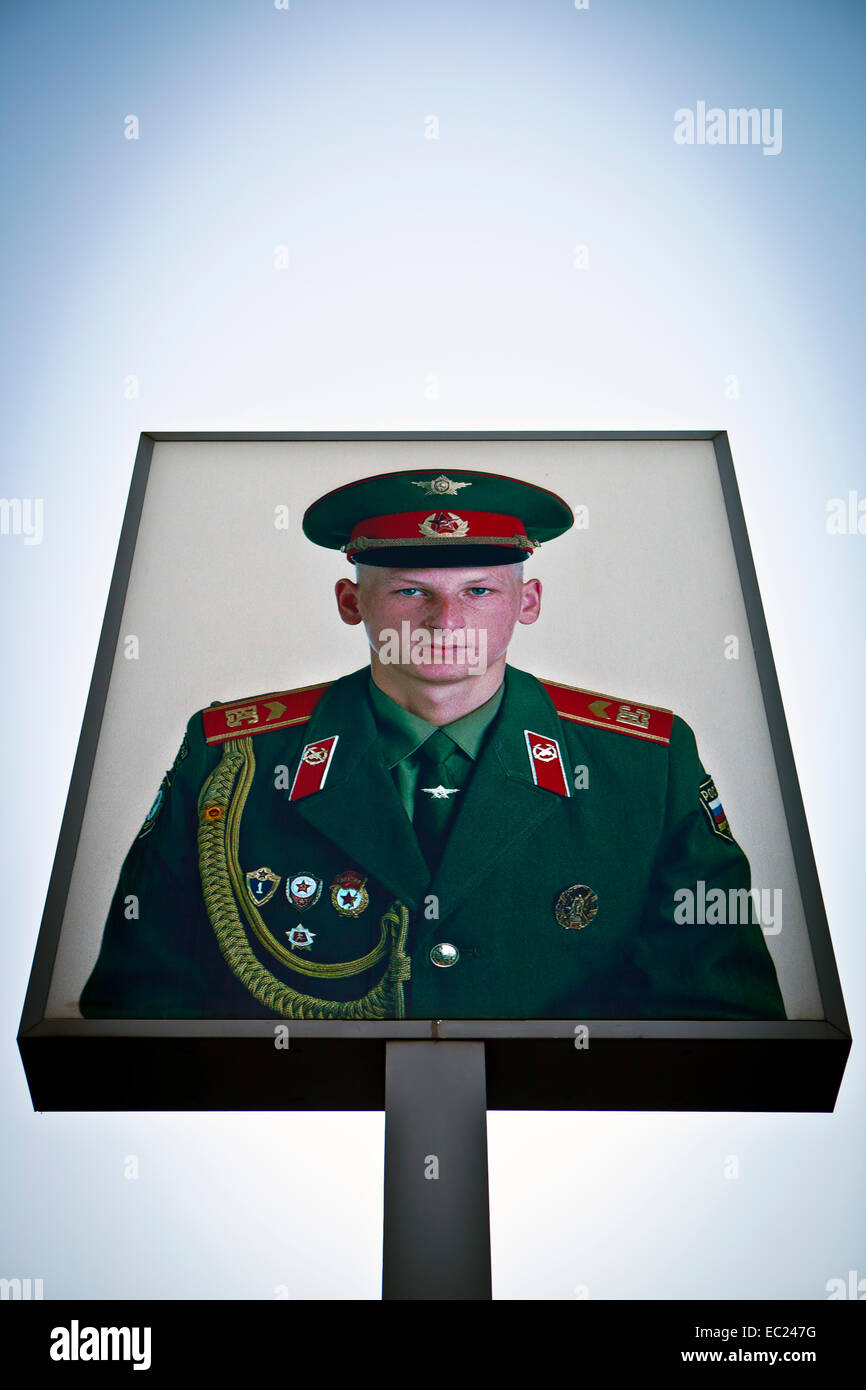 Soviet border guard depicted on poster at Checkpoint Charlie during 25th anniversary of the fall of the Berlin Wall Stock Photo