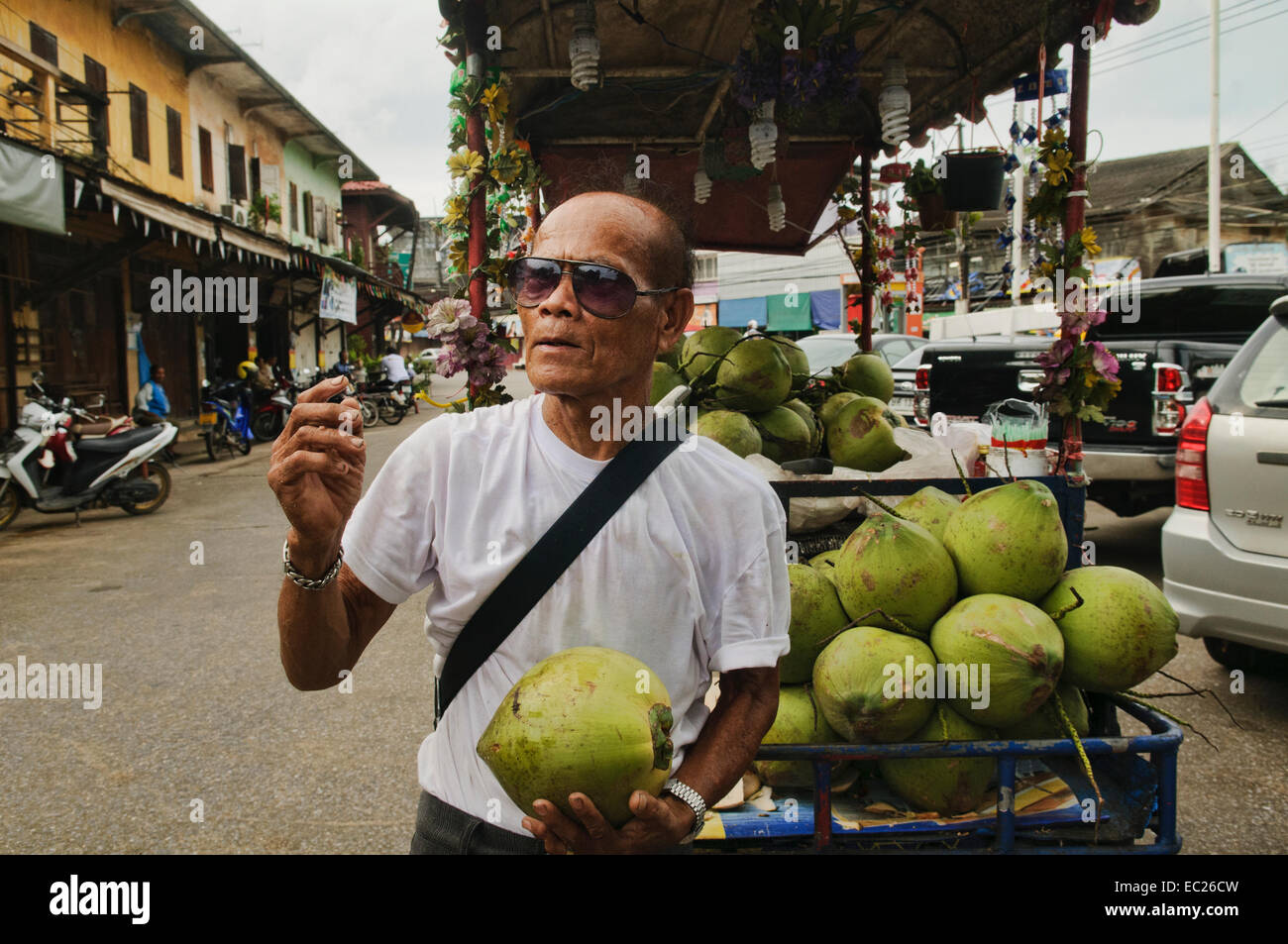 Man in coconut vendor in hi-res stock photography and images - Alamy