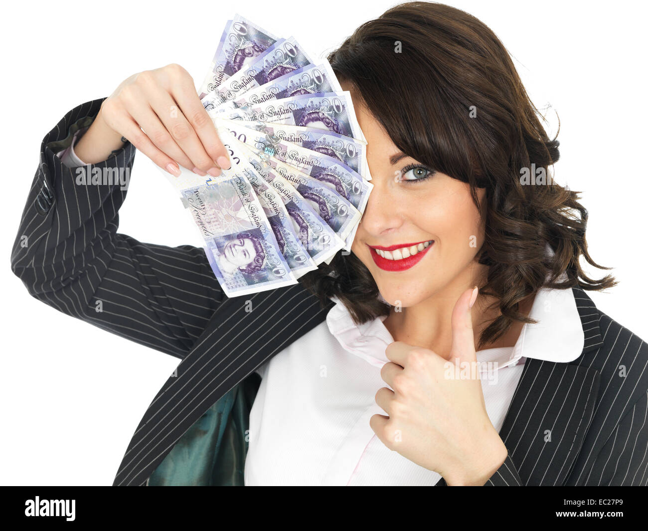 Successful Young Woman Excited Happy And Confident Celebrating Holding A Handful Of Money Isolated Against A White Background With A Clipping Path Stock Photo