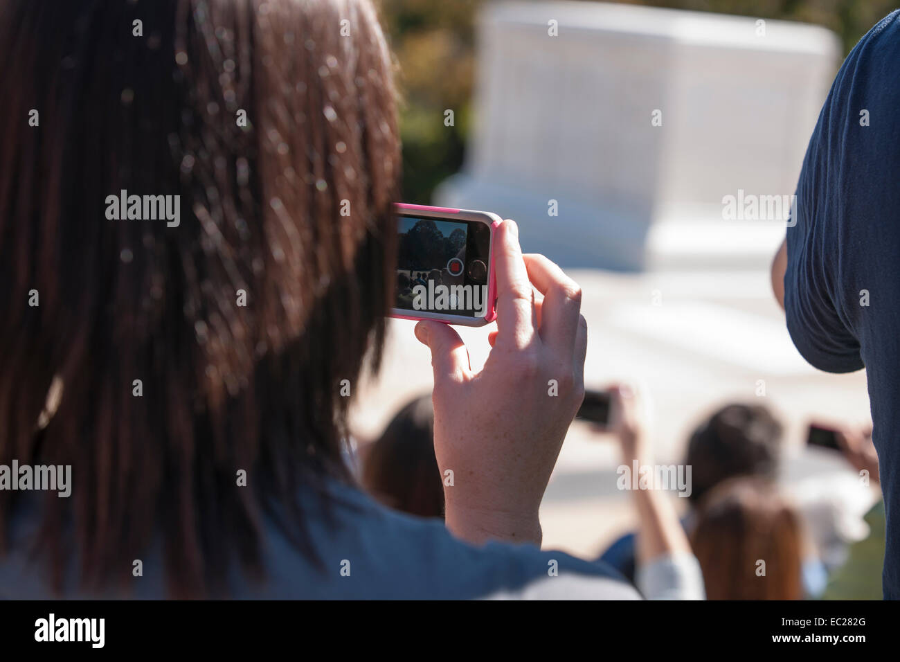 Arlington Cemetery, Tomb of the Unknown . Member of public on portable device the Changing of Guard ceremony in October 2014. Stock Photo