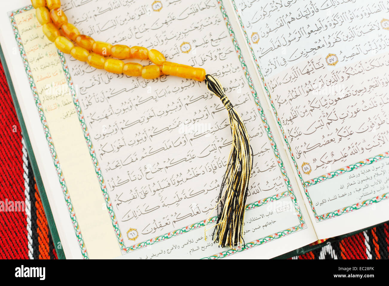 The Masbaha is also known as Tasbih is a string of prayer beads which is traditionally used by Muslims along with the Quran Stock Photo