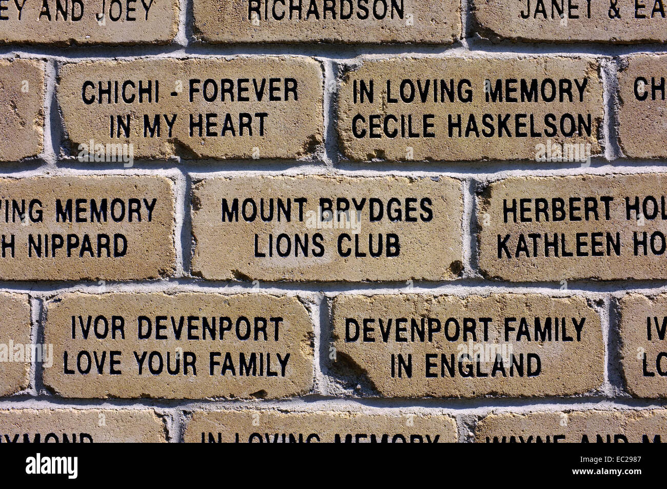 A brick wall with words carved into it Stock Photo Alamy