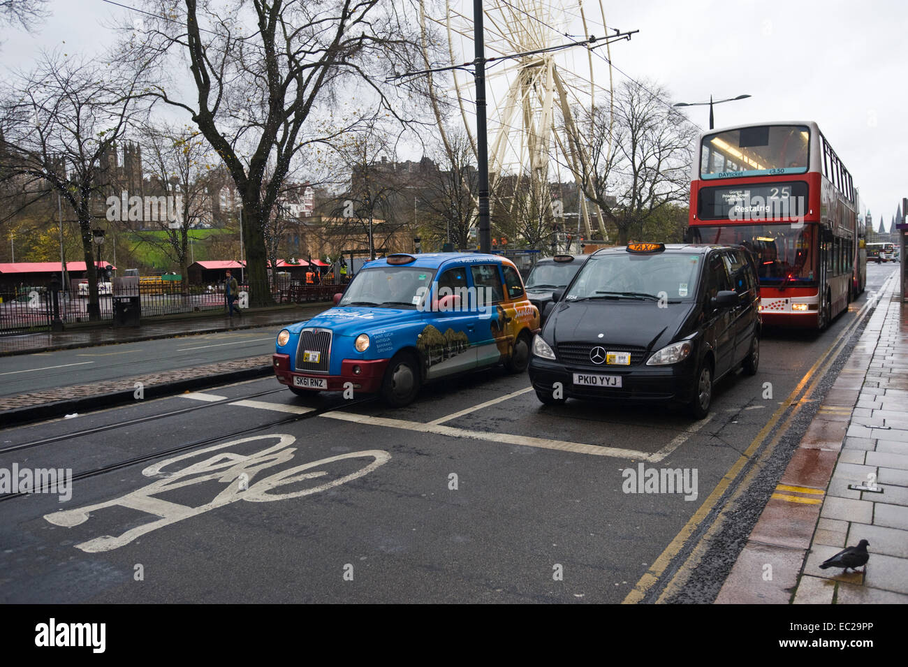 Taxis & double decker bus on Princes Street in city centre Edinburgh Scotland UK Stock Photo