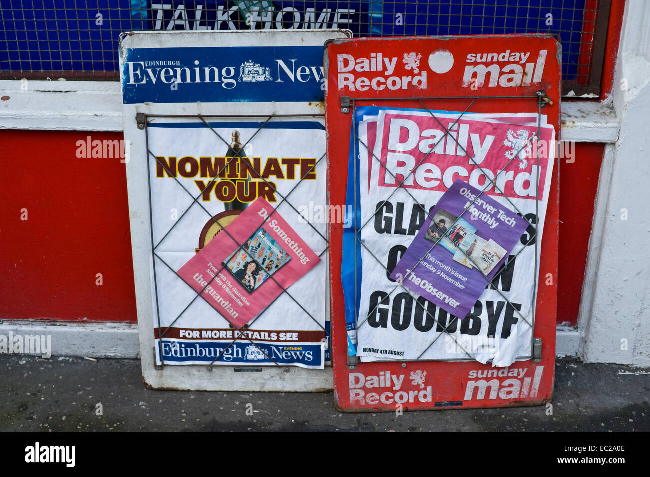 Newspaper billboards outside newsagents in city centre Edinburgh
