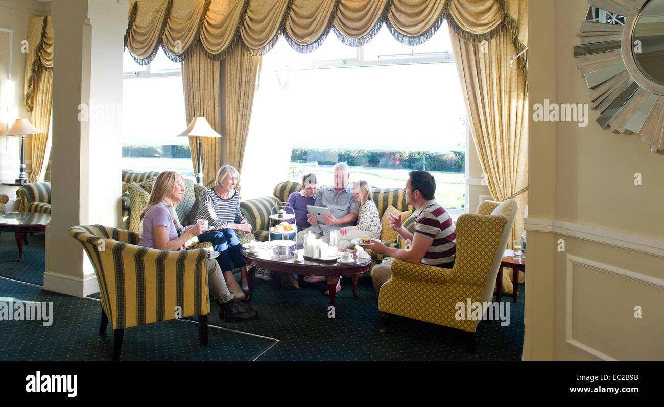 A family get together in a hotel lounge Stock Photo