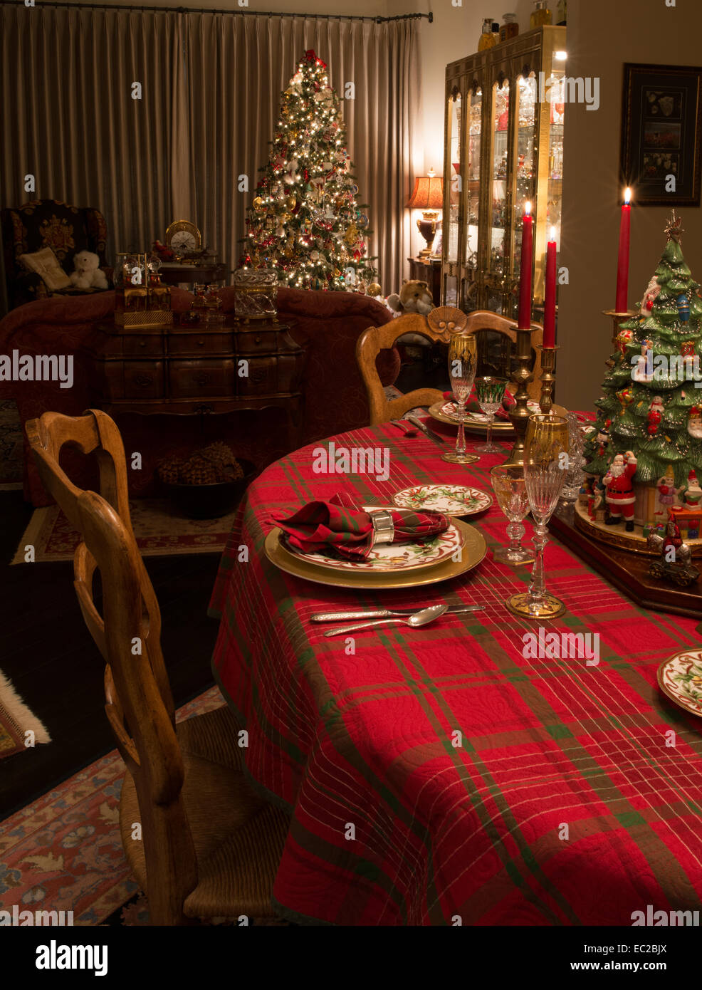Christmas Dinner Table Set With Decorated Christmas Tree In Stock