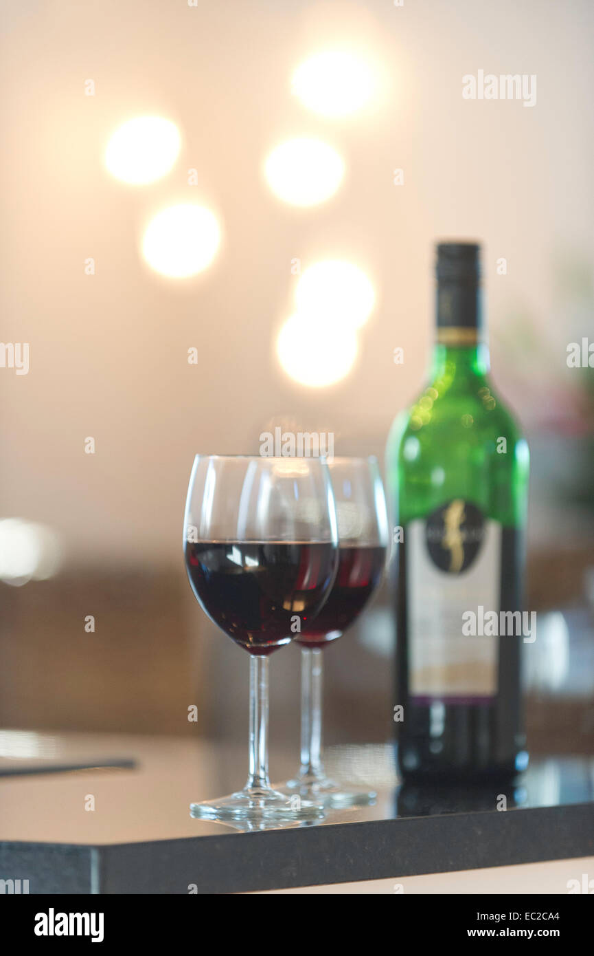 Two wine glasses and a bottle of wine Stock Photo
