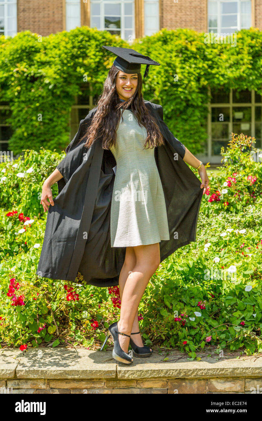 A Female University Student proudly posing in her Graduation Cap and Gown, Nottingham University Nottingham UK Stock Photo