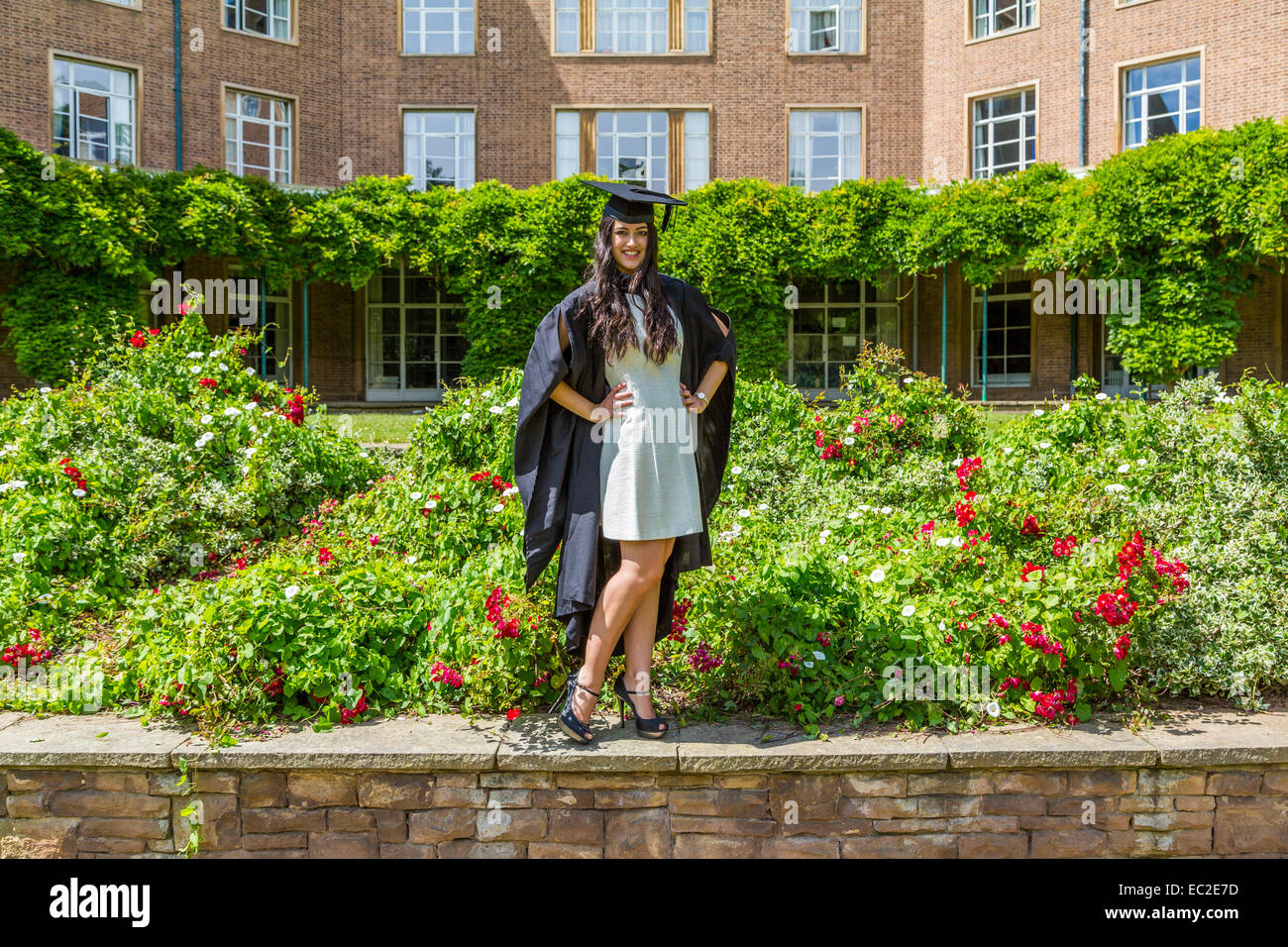 A Female University student posing in her Graduation Cap and Gown Nottingham University  Nottingham England UK Stock Photo