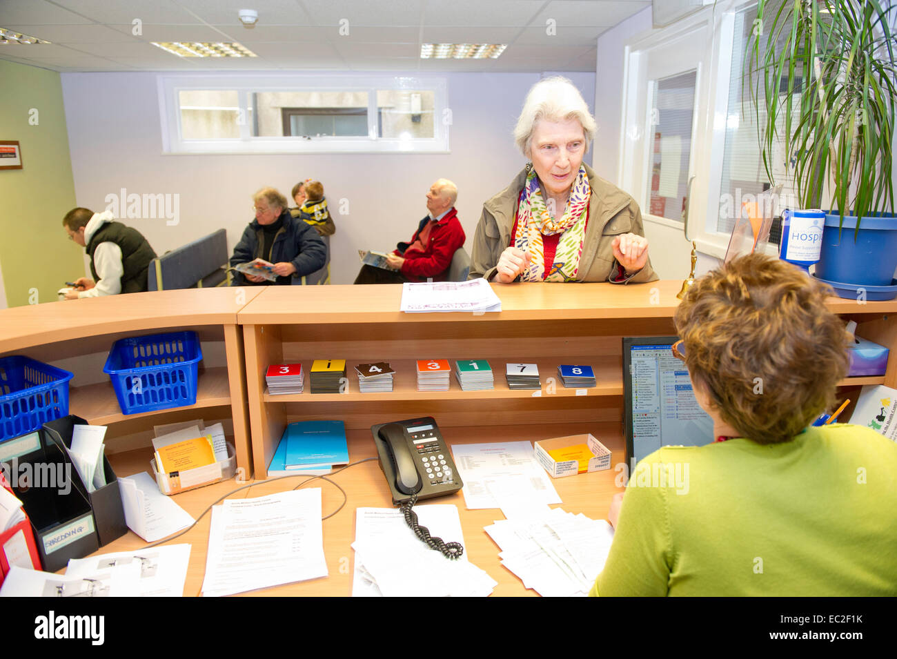 An NHS waiting room and reception desk Stock Photo