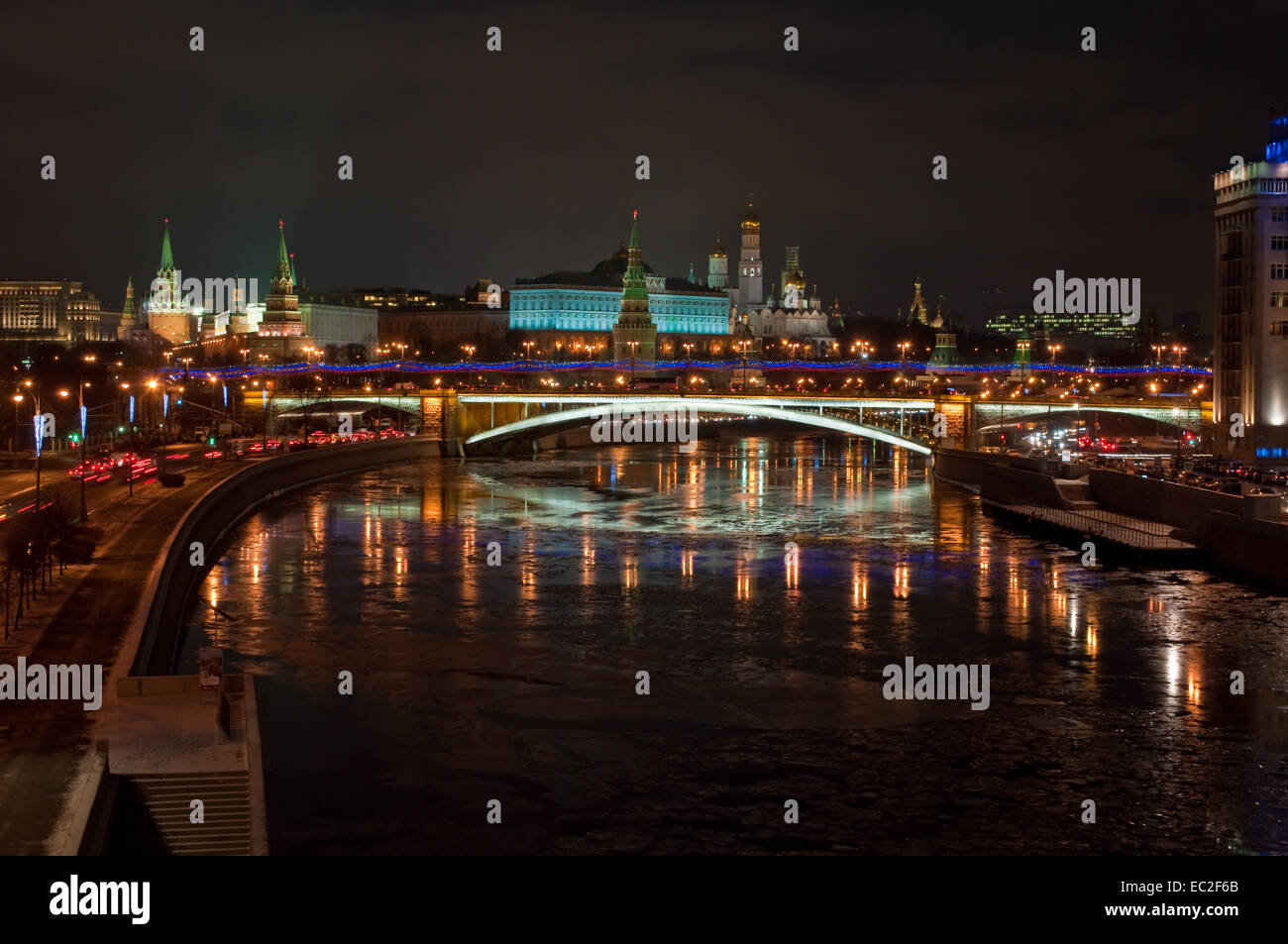 The Moscow Kremlin at night. View of the Moscow Kremlin and the Bolshoy Kamenny bridge at night. Stock Photo