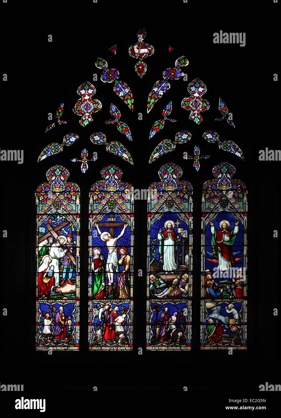 A stained glass window by William Wailes depicting The Way of the Cross, The Crucifixion, Resurrection and Ascension Stock Photo