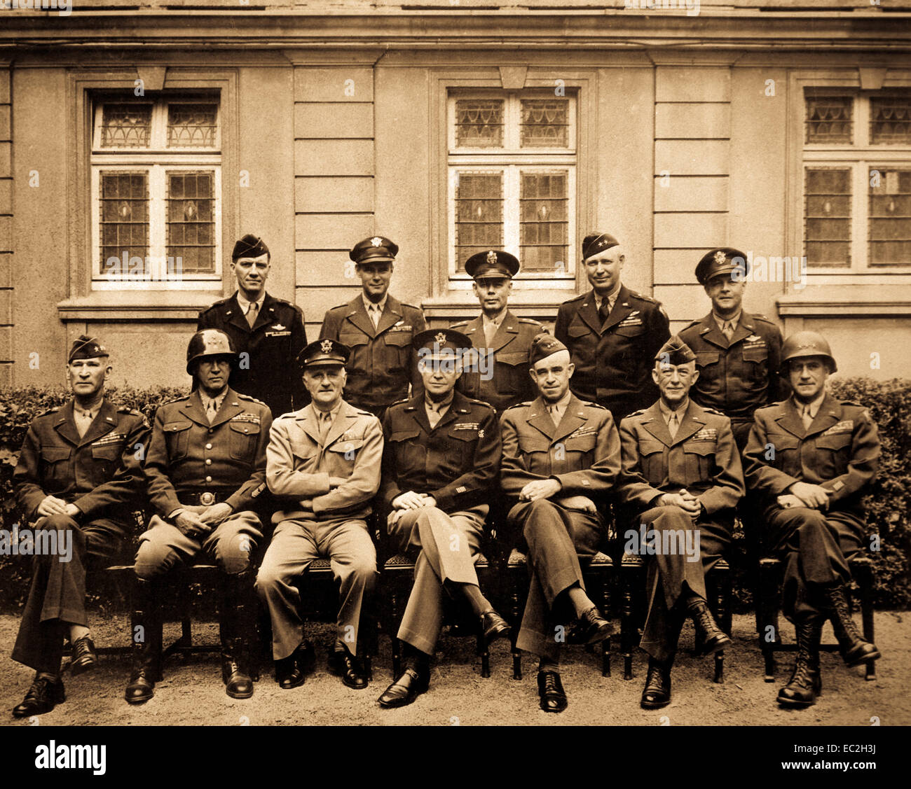 'This is the brass that did it.  Seated are Simpson, Patton, Spaatz, Dwight D. eisenhower, Bradley, Hodges and Gerow.  Standing are Stearley, Vandenberg, Smith, Weyland and Nugent.'  Ca. 1945. Army. Stock Photo