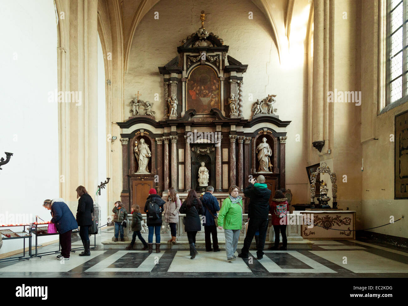 People looking at the statue of ' Madonna and Child ' by Michaelangelo, in the Church of Our lady, Bruges ( Brugge ), Belgium Stock Photo