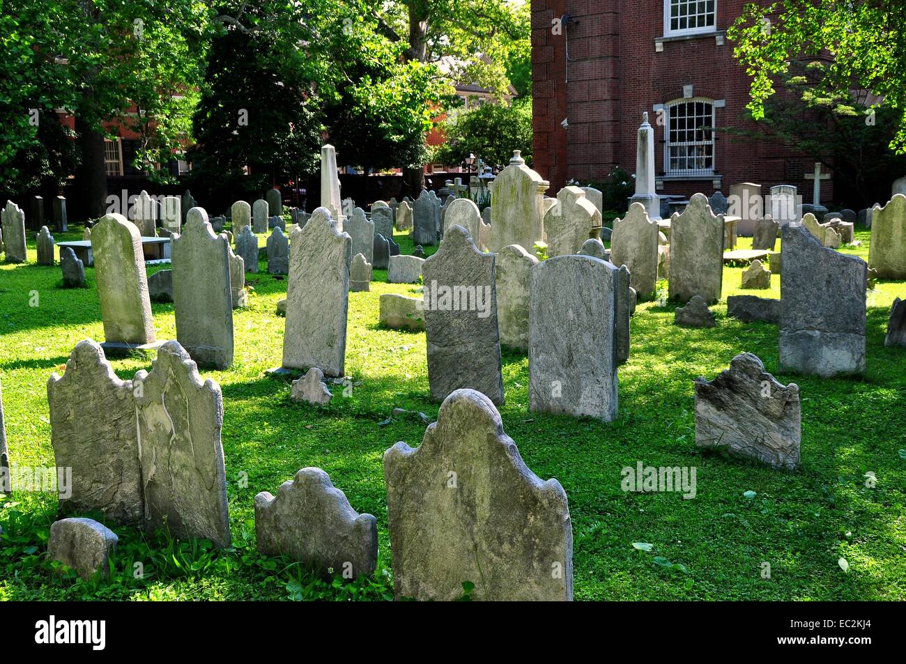Philadelphia, Pennsylvania: 18-19th centurty tombstones fill the graveyard at historic 1761 Old St. Peter's Church on Pine St. Stock Photo