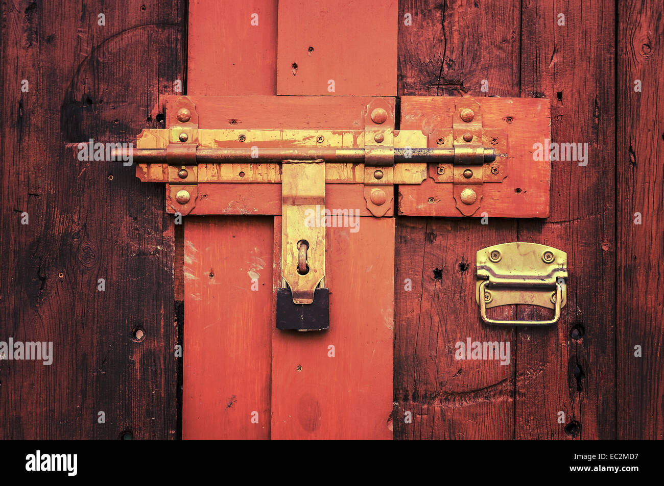 Retro vintage style picture of wooden door with lock. Stock Photo