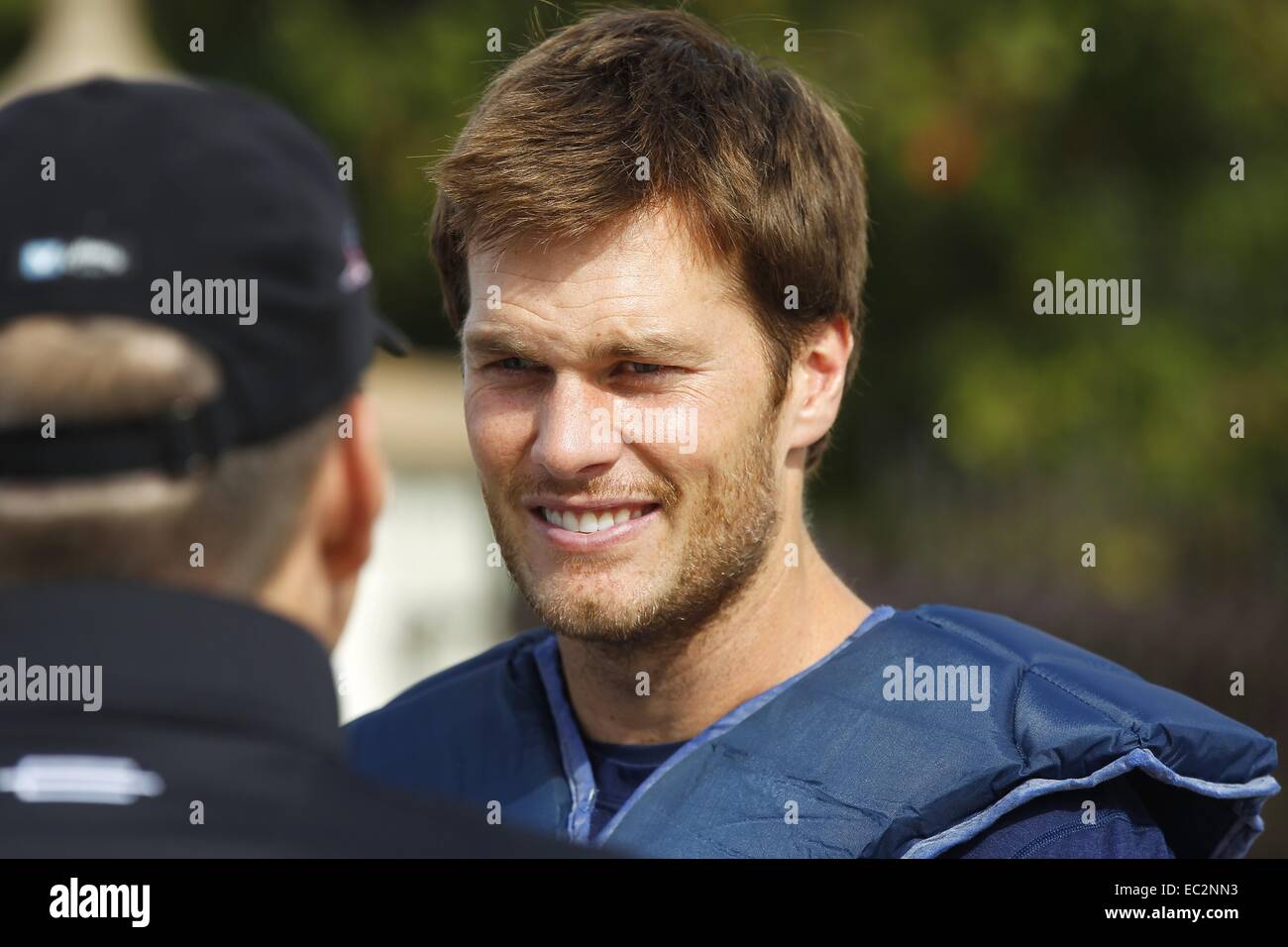 San Diego, CA, USA. 5th Dec, 2014. Dec. 5, 2014 - San Diego, California, USA - New England Patriots quarterback Tom Brady talks with Pebble Beach CEO Bill Perocchi before practice at the University of San Diego. The Patriots spent the week practicing at the school leading up to a Sunday night game against the San Diego Chargers. © KC Alfred/ZUMA Wire/Alamy Live News Stock Photo
