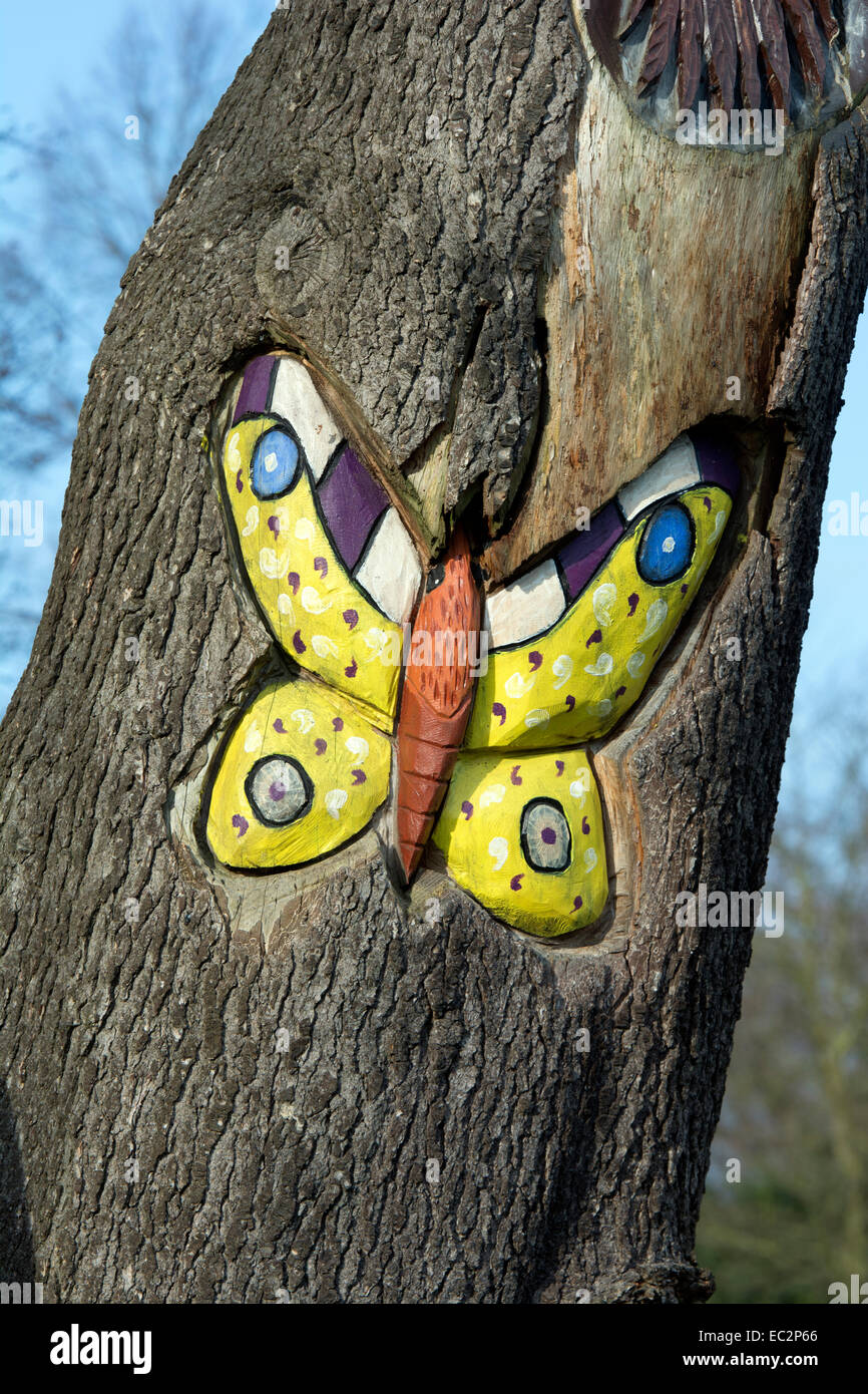 A butterfly dead tree carving in Abbey Park, Leicester, UK Stock Photo