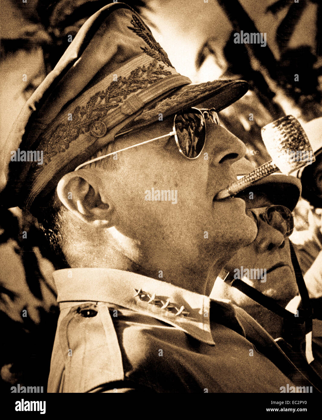 General MacArthur surveys the beachhead on Leyte Island, soon after American forces swept ashore from a gigantic liberation armada into the central Philippines, at the historic moment when the General made good his promise 'I shall return'.  1944. Stock Photo