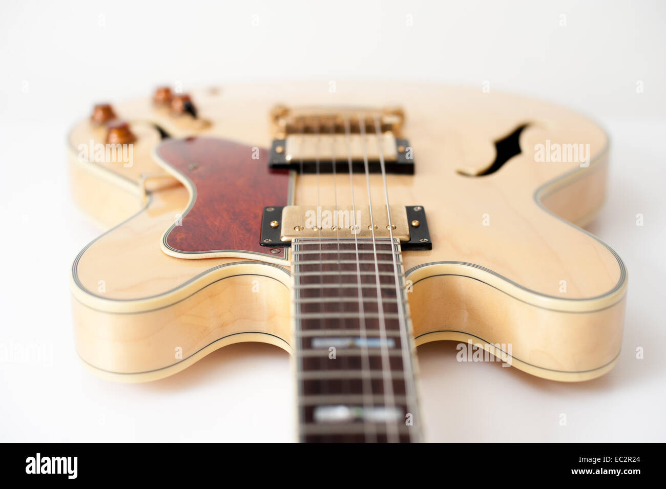 Detail of brown electric guitar with out of focus body Stock Photo