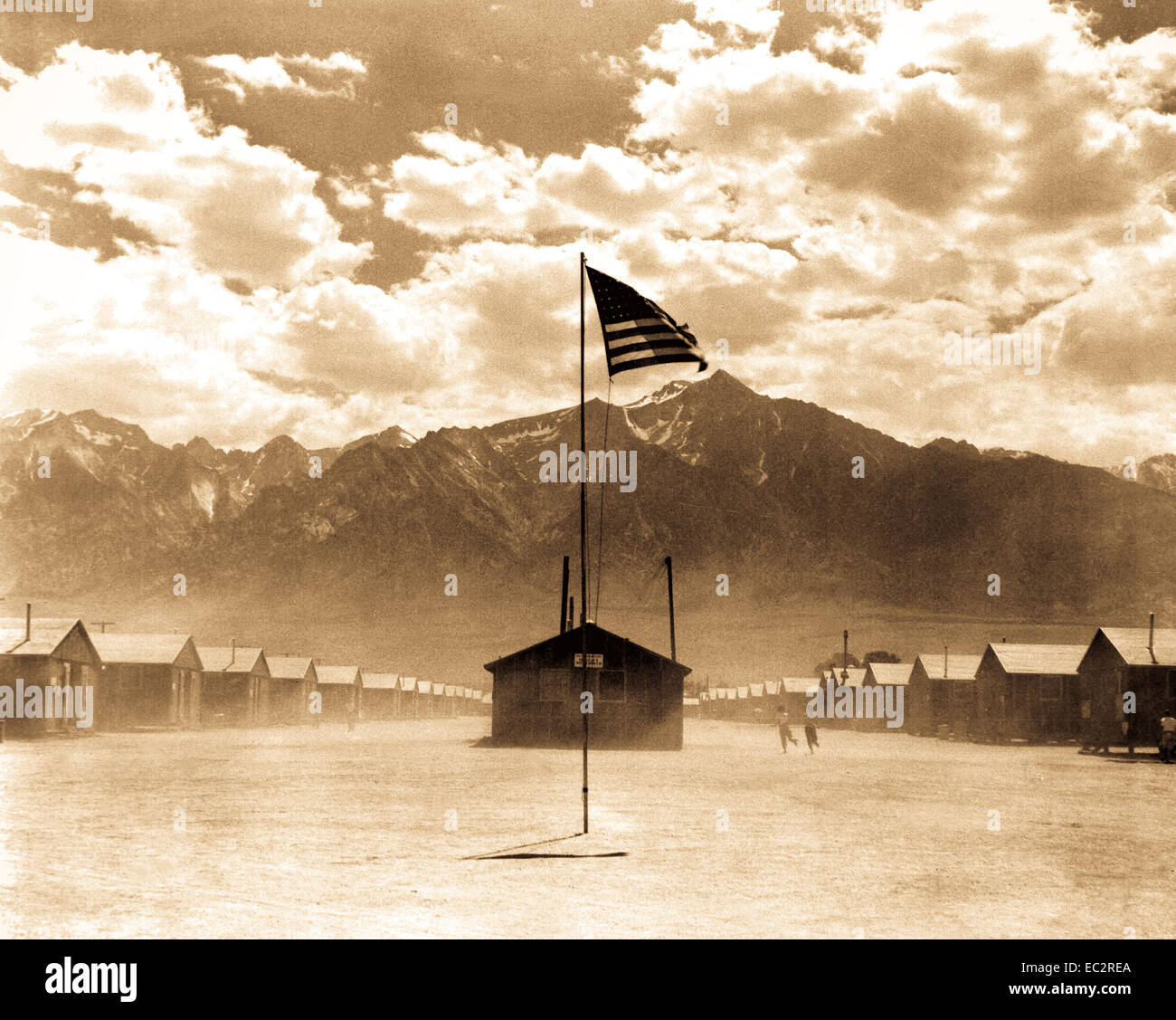 Dust storm at this War Relocation Authority center where evacuees of Japanese ancestry are spending the duration.  Manzanar, California.  July 3, 1942. Photo by Dorothea Lange. (WRA)    This archival print is available in the following sizes:    8' x 10'   $15.95 w/ FREE SHIPPING  11' x 14' $23.95 w/ FREE SHIPPING  16' x 20' $59.95 w/ FREE SHIPPING  20' x 24' $99.95 w/ FREE SHIPPING    * The American Photoarchive watermark will not appear on your print. Stock Photo