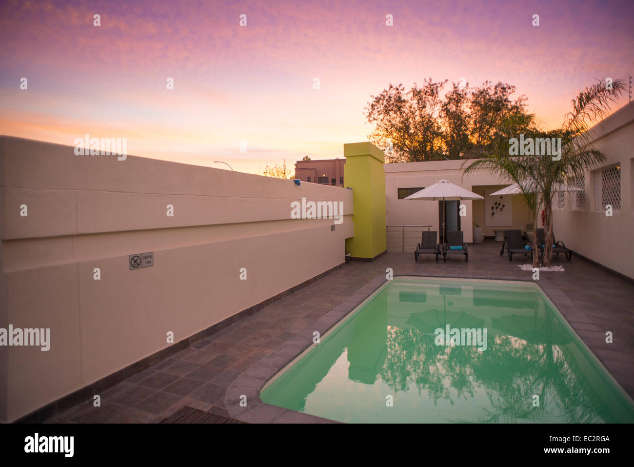 Namibia, Winhoek. Galton House Guest Lodging. Pool at sunset. Stock Photo