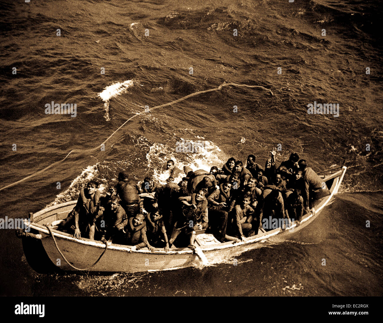 Survivors of USS PRINCETON adrift in life boat at sea as seen from USS