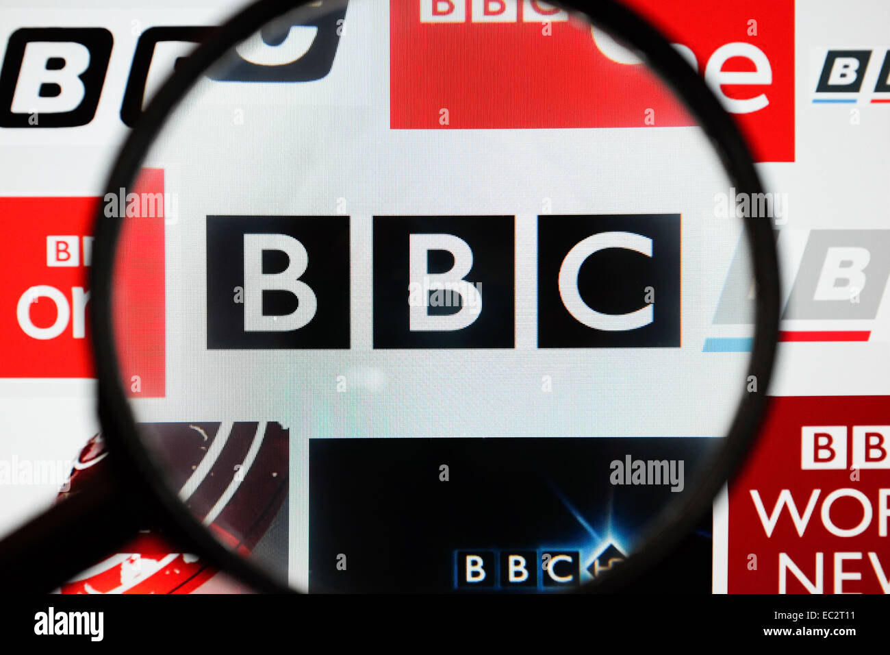 BBC logo shown through a magnifying glass. Stock Photo