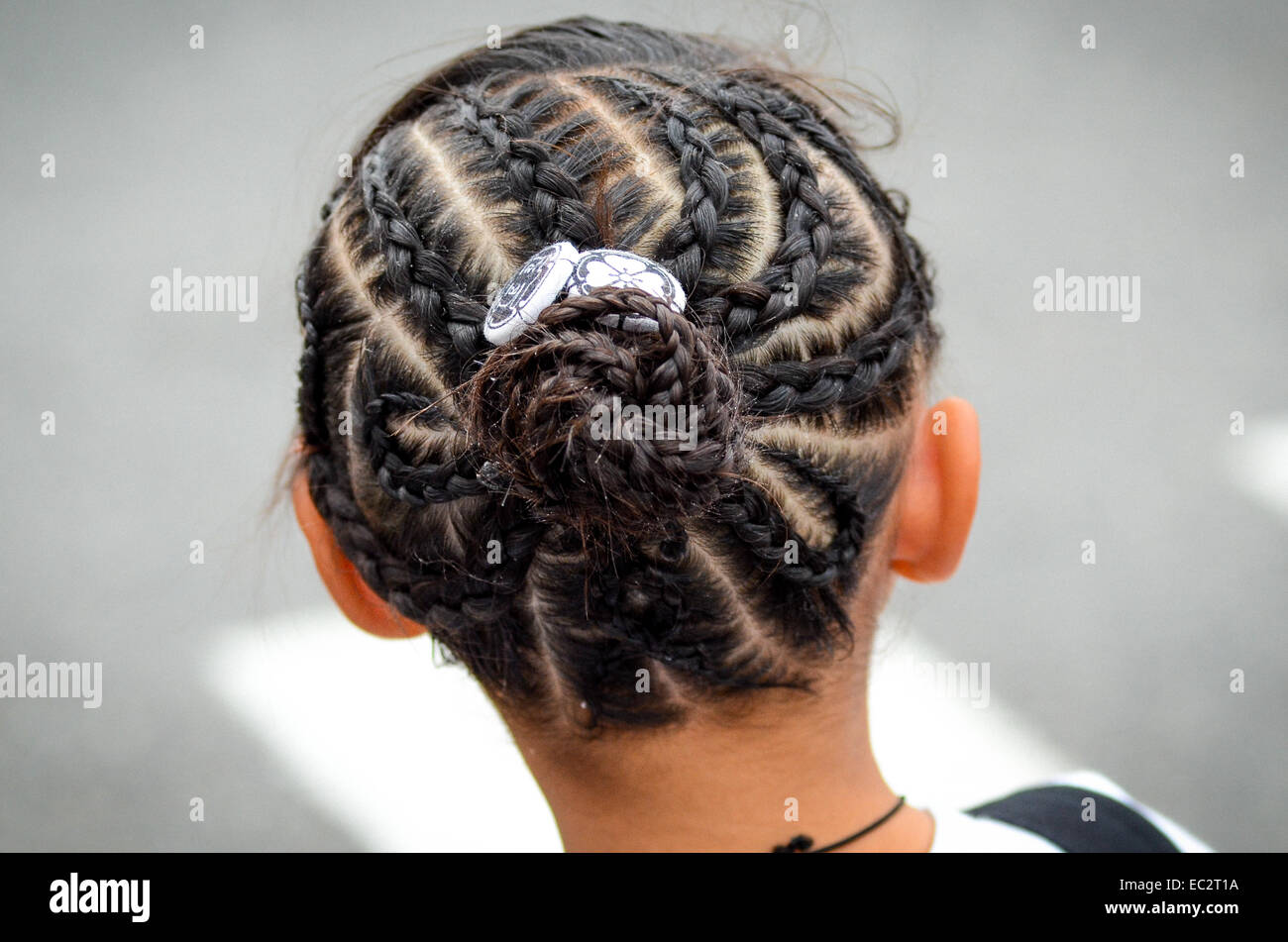 A girl with braided hair. Stock Photo