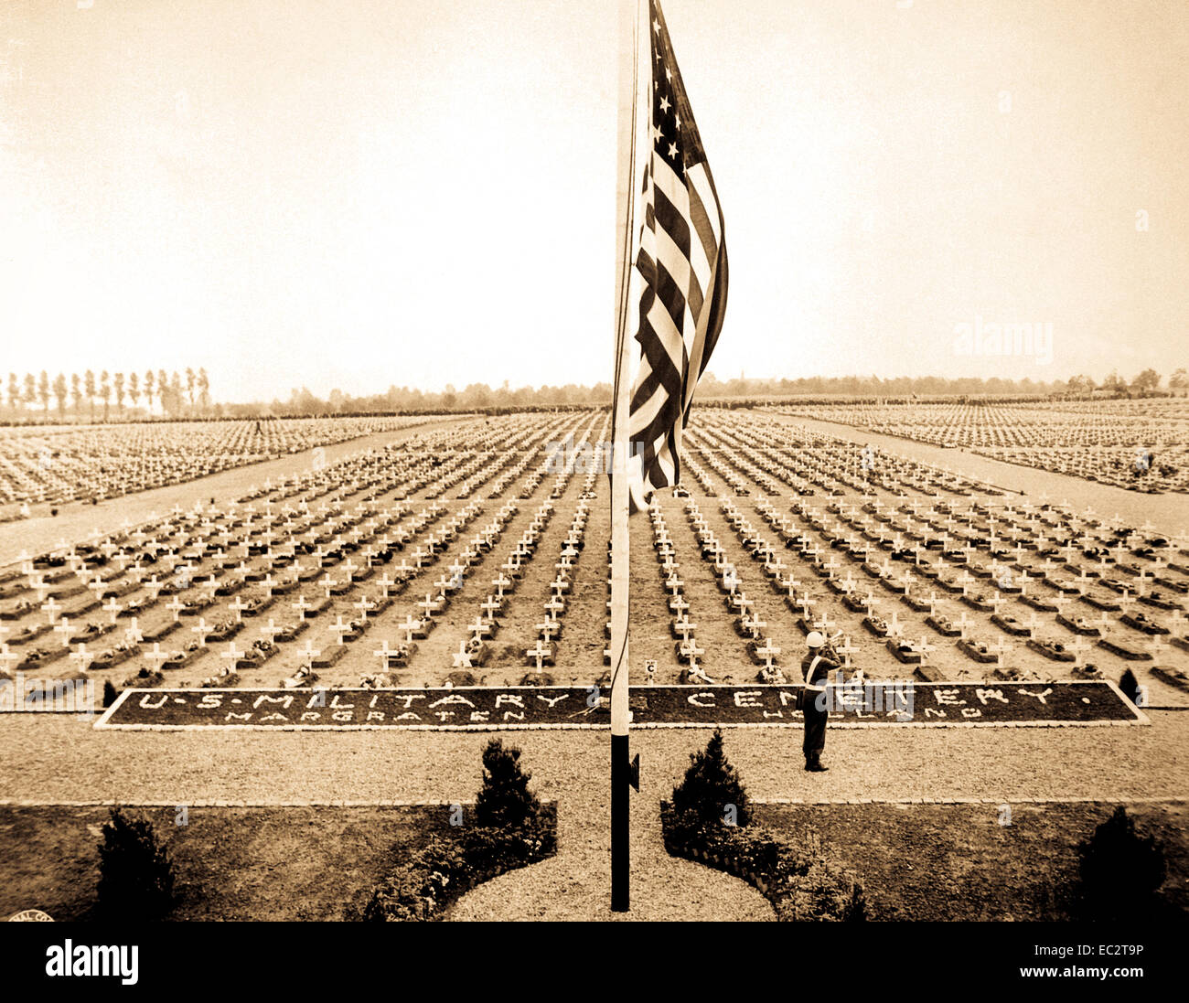 A bugler blow taps at the close of Memorial Day service at Margraten Cemetery, Holland, where lie thousands of American heroes of World War II.  May 30, 1945. Stock Photo