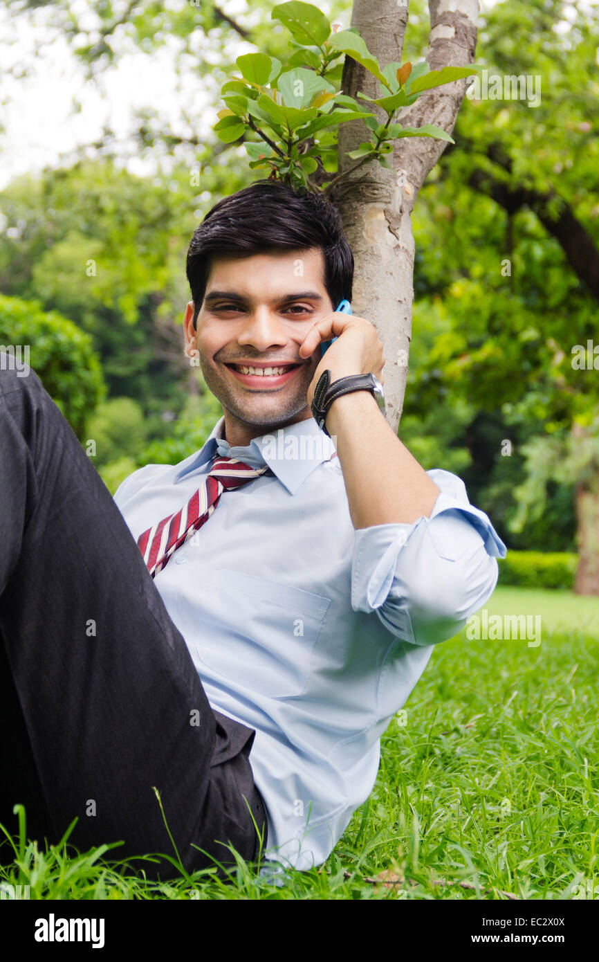 indian Business Man park talking phone Stock Photo