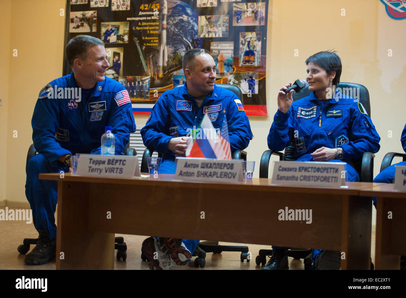 Expedition 42 prime crew members, Flight Engineer Terry Virts of NASA, left, Soyuz Commander Anton Shkaplerov of the Russian Federal Space Agency (Roscosmos), center, and Flight Engineer Samantha Cristoforetti of the European Space Agency (ESA), right, are seen during a press conference held at the Cosmonaut Hotel in Baikonur, Kazakhstan on Saturday, Nov. 22, 2014. The mission is set to launch Nov. 24 from the Baikonur Stock Photo