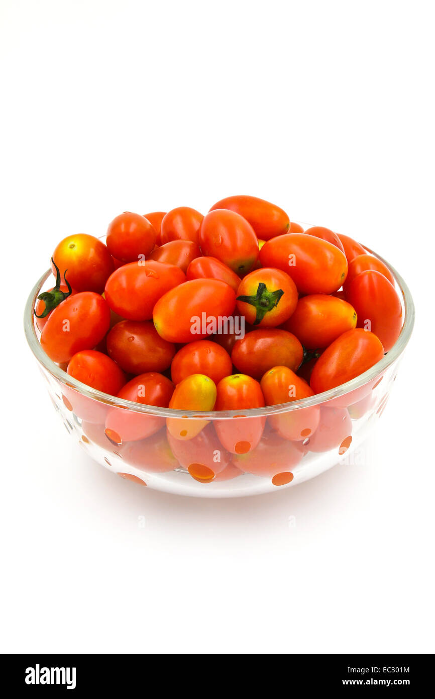 Cherry tomatoes in a glass bowl on white background Stock Photo - Alamy